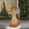Northlight 63" Gold LED Lighted Angel with Trumpet Outdoor Christmas Decoration